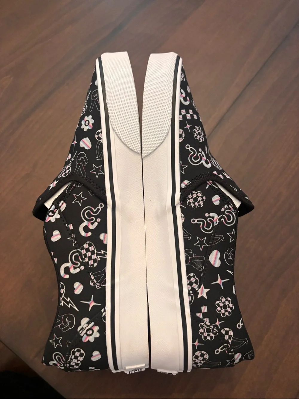 Vans Women’s Black Slip-On Sneakers with Multicolor Icon Accents